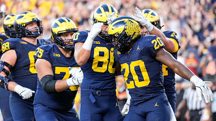 running back Kalel Mullings (20) celebrates a touchdown against USC with teammates during the second half at Michigan Stadium in Ann Arbor on Saturday, Sept. 21, 2024. running back Kalel Mullings (20) celebrates a touchdown against USC with teammates during the second half at Michigan Stadium in Ann Arbor on Saturday, Sept. 21, 2024.