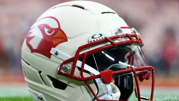 Sep 25, 2025; Glendale, Arizona, USA;  Detail view of the Arizona Cardinals helmet on the field before the game against the Seattle Seahawks at State Farm Stadium. Mandatory Credit: Mark J. Rebilas-Imagn Images
