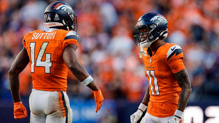 Oct 19, 2025; Denver, Colorado, USA; Denver Broncos wide receiver Troy Franklin (11) reacts with wide receiver Courtland Sutton (14) after a play in the fourth quarter against the New York Giants at Empower Field at Mile High. Oct 19, 2025; Denver, Colorado, USA; Denver Broncos wide receiver Troy Franklin (11) reacts with wide receiver Courtland Sutton (14) after a play in the fourth quarter against the New York Giants at Empower Field at Mile High.