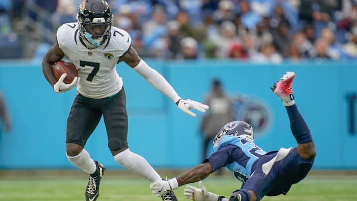 Jacksonville Jaguars wide receiver Brian Thomas Jr. (7) slips past Tennessee Titans cornerback Jarvis Brownlee Jr. (29) during the third quarter at Nissan Stadium in Nashville, Tenn., Sunday, Dec. 8, 2024.