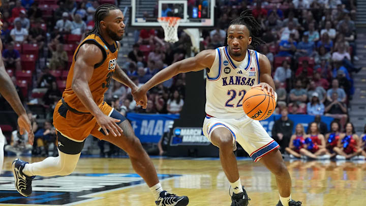 Mar 20, 2026; San Diego, CA, USA; Kansas Jayhawks guard Darryn Peterson (22) controls the ball against California Baptist Lancers guard Martel Williams (33) in the first half during a first round game of the men's 2026 NCAA Tournament at Viejas Arena. Mandatory Credit: Kirby Lee-Imagn Images Mar 20, 2026; San Diego, CA, USA; Kansas Jayhawks guard Darryn Peterson (22) controls the ball against California Baptist Lancers guard Martel Williams (33) in the first half during a first round game of the men's 2026 NCAA Tournament at Viejas Arena. Mandatory Credit: Kirby Lee-Imagn Images