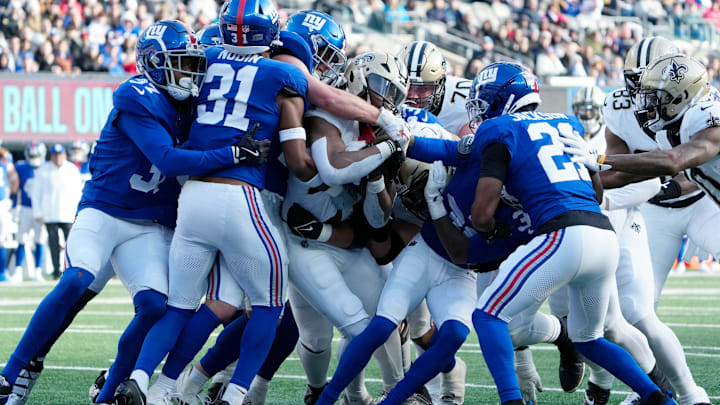 New Orleans Saints running back Kendre Miller (25) and his teammates go up against the New York Giants by the one yard line just before scoring the only touchdown of the first quarter, Sunday, December 8, 2024. New Orleans Saints running back Kendre Miller (25) and his teammates go up against the New York Giants by the one yard line just before scoring the only touchdown of the first quarter, Sunday, December 8, 2024.