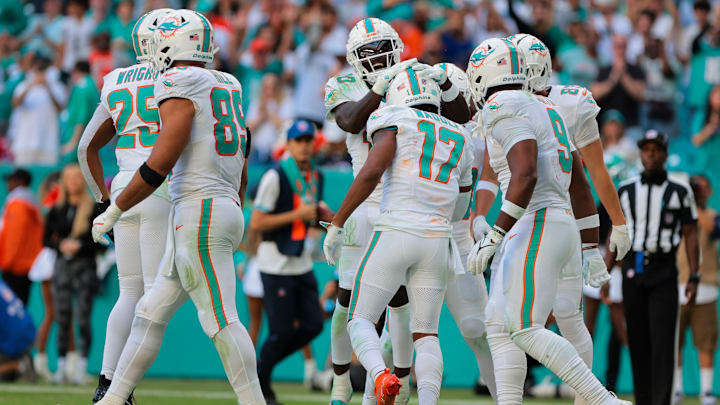 Miami Dolphins wide receiver Jaylen Waddle (17) celebrates with wide receiver Tyreek Hill (10) after scoring a touchdown against the New England Patriots during the third quarter at Hard Rock Stadium.