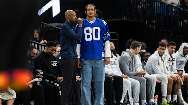 Orlando Magic head coach Jamahl Mosley and Orlando Magic forward Paolo Banchero (5) talk in the second quarter at Kia Center.