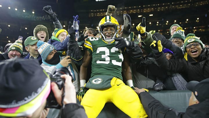 Nov 11, 2018; Green Bay, WI, USA; Green Bay Packers running back Aaron Jones (33) celebrates a touchdown with the Lambeau leap during the 3rd quarter against the Miami Dolphins at Lambeau Field. Mandatory Credit: Mike De Sisti/Milwaukee Journal Sentinel via USA TODAY NETWORK