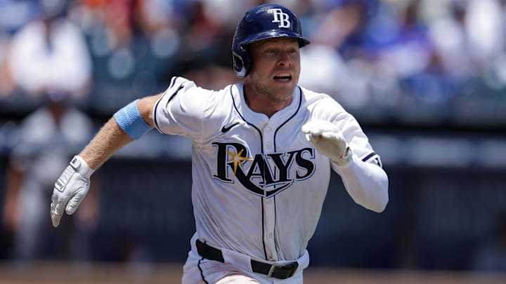 Aug 3, 2025; Tampa, Florida, USA; Tampa Bay Rays shortstop Taylor Walls (6) singles against the Los Angeles Dodgers in the fifth inning at George M. Steinbrenner Field. 
