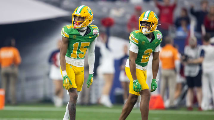Jan 1, 2024; Glendale, AZ, USA; Oregon Ducks wide receiver Gary Bryant Jr. (2) and Tez Johnson (15) against the Liberty Flames during the 2024 Fiesta Bowl at State Farm Stadium. Mandatory Credit: Mark J. Rebilas-USA TODAY Sports