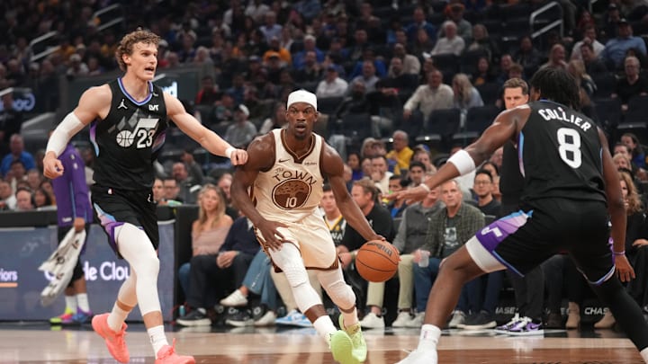 Nov 24, 2025; San Francisco, California, USA; Golden State Warriors forward Jimmy Butler III (10) dribbles past Utah Jazz forward Lauri Markkanen (23) in the second quarter at the Chase Center. Mandatory Credit: Cary Edmondson-Imagn Images