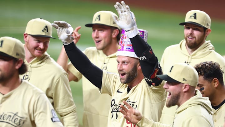 Apr 30, 2024; Phoenix, Arizona, USA; Arizona Diamondbacks first baseman Christian Walker celebrates with teammates after hitting a two run walk off home run in the tenth inning against the Los Angeles Dodgers at Chase Field. Mandatory Credit: Mark J. Rebilas-Imagn Images Apr 30, 2024; Phoenix, Arizona, USA; Arizona Diamondbacks first baseman Christian Walker celebrates with teammates after hitting a two run walk off home run in the tenth inning against the Los Angeles Dodgers at Chase Field. Mandatory Credit: Mark J. Rebilas-Imagn Images