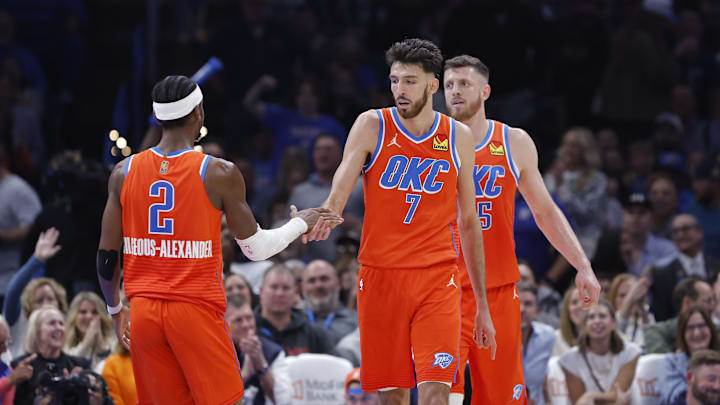 Nov 11, 2025; Oklahoma City, Oklahoma, USA; Oklahoma City Thunder center Chet Holmgren (7) and Oklahoma City Thunder guard Shai Gilgeous-Alexander (2) celebrate after scoring against the Golden State Warriors during the second half at Paycom Center. Mandatory Credit: Alonzo Adams-Imagn Images