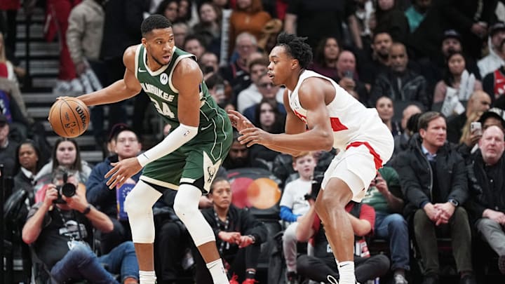 Jan 6, 2025; Toronto, Ontario, CAN; Milwaukee Bucks forward Giannis Antetokounmpo (34) controls the ball as Toronto Raptors forward Scottie Barnes (4) defends during the third quarter at Scotiabank Arena. Mandatory Credit: Nick Turchiaro-Imagn Images Jan 6, 2025; Toronto, Ontario, CAN; Milwaukee Bucks forward Giannis Antetokounmpo (34) controls the ball as Toronto Raptors forward Scottie Barnes (4) defends during the third quarter at Scotiabank Arena. Mandatory Credit: Nick Turchiaro-Imagn Images