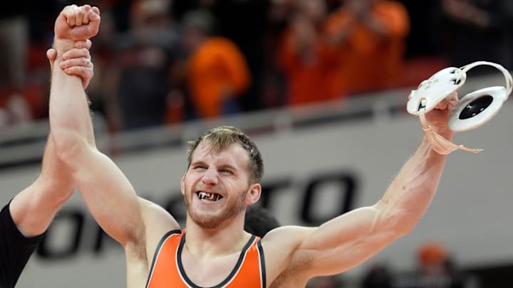Oklahoma State's Caleb Fish celebrates his win over Air Force's Ej Beloncik in the 157-pound match during the college wrestling dual between Oklahoma State and Air Force at Gallagher-Iba Arena in Stillwater, Okla., Friday, Jan., 3, 2025.