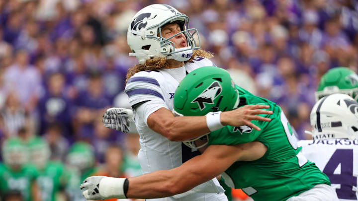 Aug 30, 2025; Manhattan, Kansas, USA; Kansas State Wildcats quarterback Avery Johnson (2) is hit by North Dakota Fighting Hawks edge Grady Kentch (92) after throwing the ball during the first quarter at Bill Snyder Family Football Stadium. Mandatory Credit: Scott Sewell-Imagn Images