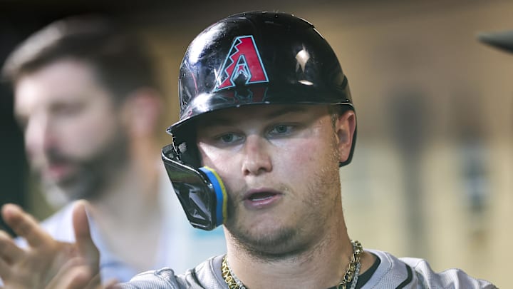 Sep 8, 2024; Houston, Texas, USA; Arizona Diamondbacks designated hitter Joc Pederson (3) celebrates in the dugout after scoring a run during the third inning against the Houston Astros at Minute Maid Park.