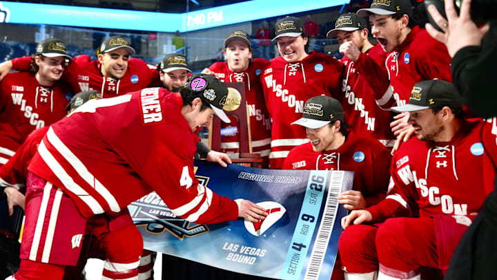 Ben Dexheimer places the Wisconsin sticker on the Frozen Four ticket at DCU Center on March 28, 2026. Ben Dexheimer places the Wisconsin sticker on the Frozen Four ticket at DCU Center on March 28, 2026.