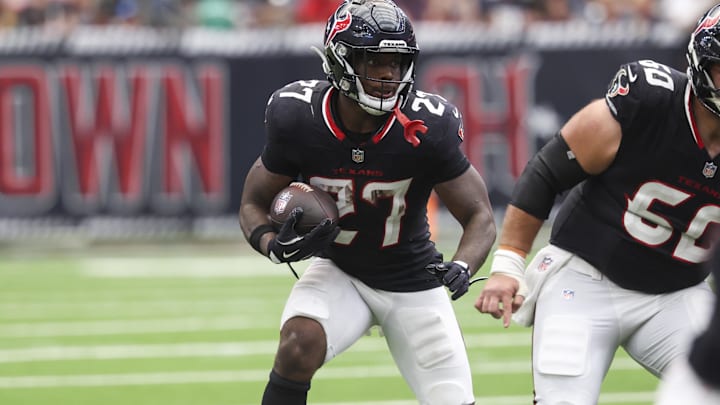 Sep 28, 2025; Houston, Texas, USA; Houston Texans running back Woody Marks (27) runs with the ball during the fourth quarter against the Tennessee Titans at NRG Stadium.