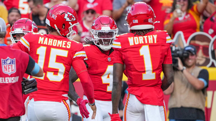 Sep 15, 2024; Kansas City, Missouri, USA; Kansas City Chiefs wide receiver Rashee Rice (4) celebrates after scoring against the Cincinnati Bengals during the game at GEHA Field at Arrowhead Stadium. Mandatory Credit: Denny Medley-Imagn Images