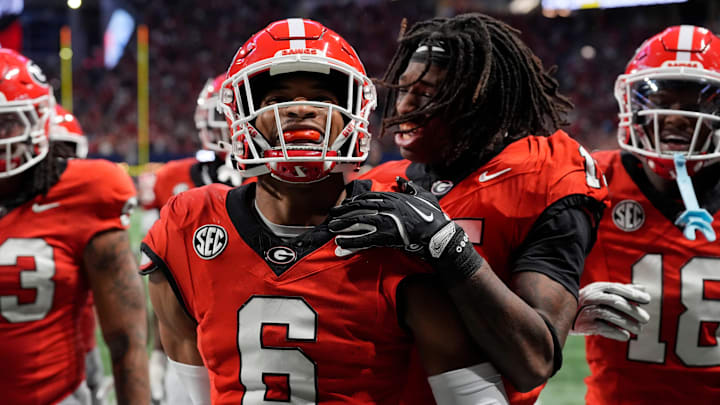 Georgia defensive back Daylen Everette (6) celebrates with his teammates after picking off a pass from Texas quarterback Quinn Ewers (3) during the second half of the SEC championship game against Texas in Atlanta, on Saturday, Dec. 7, 2024. Georgia defensive back Daylen Everette (6) celebrates with his teammates after picking off a pass from Texas quarterback Quinn Ewers (3) during the second half of the SEC championship game against Texas in Atlanta, on Saturday, Dec. 7, 2024.