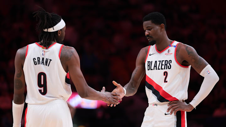 Jan 21, 2025; Miami, Florida, USA; Portland Trail Blazers center Deandre Ayton (2) shakes hands with forward Jerami Grant (9) before the third quarter against the Miami Heat at Kaseya Center. Mandatory Credit: Sam Navarro-Imagn Images