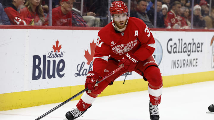Dec 23, 2024; Detroit, Michigan, USA;  Detroit Red Wings left wing J.T. Compher (37) skates with the puck in the second period against the St. Louis Blues at Little Caesars Arena. Mandatory Credit: Rick Osentoski-Imagn Images
