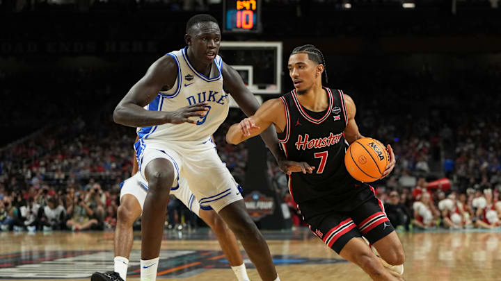Apr 5, 2025; San Antonio, TX, USA; Houston Cougars guard Milos Uzan (7) dribbles the ball against Duke Blue Devils center Khaman Maluach (9) during the first half in the semifinals of the men's Final Four of the 2025 NCAA Tournament at the Alamodome. Mandatory Credit: Bob Donnan-Imagn Images Apr 5, 2025; San Antonio, TX, USA; Houston Cougars guard Milos Uzan (7) dribbles the ball against Duke Blue Devils center Khaman Maluach (9) during the first half in the semifinals of the men's Final Four of the 2025 NCAA Tournament at the Alamodome. Mandatory Credit: Bob Donnan-Imagn Images