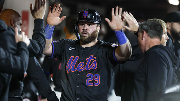 Sep 2, 2024; New York City, New York, USA;  New York Mets left fielder DJ Stewart (29) celebrates in the dugout with his teammates after scoring a run in the fourth inning against the Boston Red Sox at Citi Field. Mandatory Credit: Wendell Cruz-Imagn Images