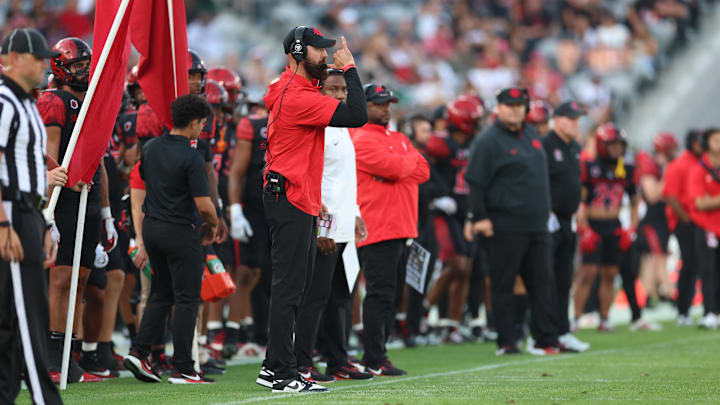 Oct 5, 2024; San Diego, California, USA; San Diego State Aztecs head coach Sean Lewis calls a play. Oct 5, 2024; San Diego, California, USA; San Diego State Aztecs head coach Sean Lewis calls a play.