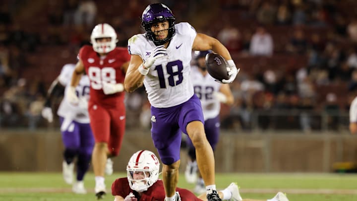 Aug 30, 2024; Stanford, California, USA; TCU Horned Frogs wide receiver Jack Bech (18) runs with the ball past Stanford Cardinal safety Scotty Edwards (21) during the second half at Stanford Stadium. Mandatory Credit: Sergio Estrada-Imagn Images