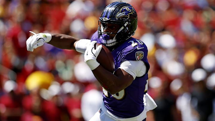 Aug 23, 2025; Landover, Maryland, USA; Baltimore Ravens running back Rasheen Ali (26) runs the ball for a touchdown during the first quarter against the Washington Commanders at Northwest Stadium. Mandatory Credit: Peter Casey-Imagn Images