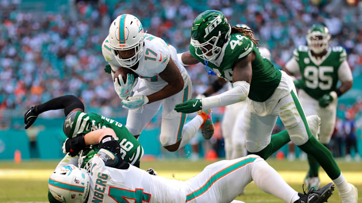 Miami Dolphins wide receiver Jaylen Waddle (17) dives over New York Jets safety Chuck Clark (36) after running with the football during the fourth quarter at Hard Rock Stadium. 