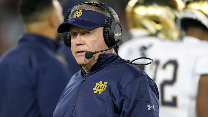 Nov 27, 2021; Stanford, California, USA; Notre Dame Fighting Irish head coach Brian Kelly walks on the field during the second quarter against the Stanford Cardinal at Stanford Stadium. 