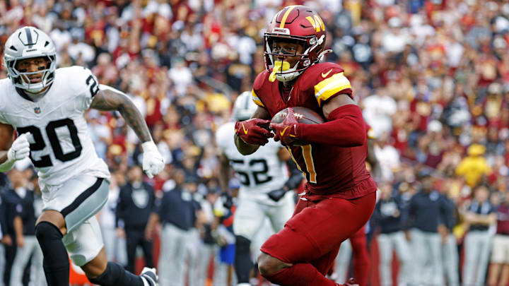 Sep 21, 2025; Landover, Maryland, USA; Washington Commanders wide receiver Terry McLaurin (17) runs the ball during the second half as Las Vegas Raiders safety Isaiah Pola-Mao (20) defends at Northwest Stadium. Mandatory Credit: Amber Searls-Imagn Images Sep 21, 2025; Landover, Maryland, USA; Washington Commanders wide receiver Terry McLaurin (17) runs the ball during the second half as Las Vegas Raiders safety Isaiah Pola-Mao (20) defends at Northwest Stadium. Mandatory Credit: Amber Searls-Imagn Images