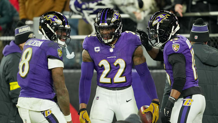 Jan 11, 2025; Baltimore, Maryland, USA; Baltimore Ravens running back Derrick Henry (22) celebrates with wide receiver Nelson Agholor (15) and quarterback Lamar Jackson (8) after scoring a touchdown against the Pittsburgh Steelers in the third quarter in an AFC wild card game at M&T Bank Stadium. Mandatory Credit: Mitch Stringer-Imagn Images