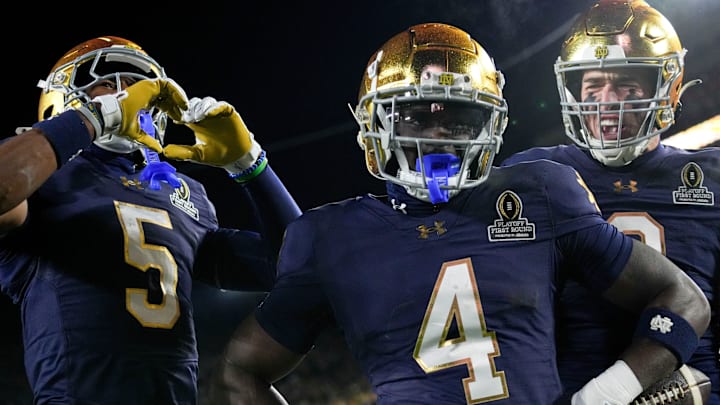 Notre Dame Fighting Irish running back Jeremiyah Love (4) celebrates after scoring a touchdown during the first half of a game between the Indiana Hoosiers and the Notre Dame Fighting Irish in first round of the College Football Playoff on Friday, Dec. 20, 2024, in South Bend.