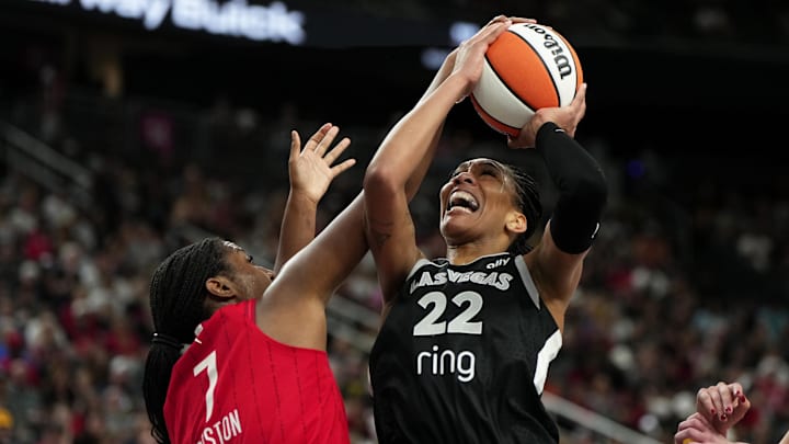 Jun 22, 2025; Las Vegas, Nevada, USA; Las Vegas Aces center A'ja Wilson (22) battles for the ball against Indiana Fever center Aliyah Boston (7) during the first half of a WNBA basketball game at T-Mobile Arena. Mandatory Credit: Lucas Peltier-Imagn Images Jun 22, 2025; Las Vegas, Nevada, USA; Las Vegas Aces center A'ja Wilson (22) battles for the ball against Indiana Fever center Aliyah Boston (7) during the first half of a WNBA basketball game at T-Mobile Arena. Mandatory Credit: Lucas Peltier-Imagn Images