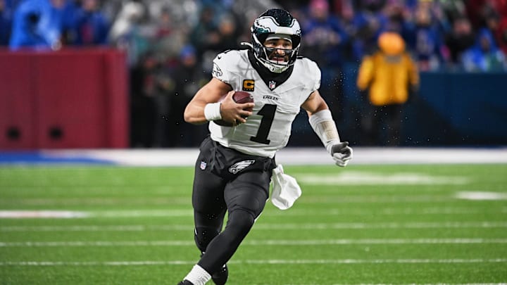 Dec 28, 2025; Orchard Park, New York, USA; Philadelphia Eagles quarterback Jalen Hurts (1) runs the ball against against the Buffalo Bills during the second quarter at Highmark Stadium. Mandatory Credit: Mark Konezny-Imagn Images Dec 28, 2025; Orchard Park, New York, USA; Philadelphia Eagles quarterback Jalen Hurts (1) runs the ball against against the Buffalo Bills during the second quarter at Highmark Stadium. Mandatory Credit: Mark Konezny-Imagn Images