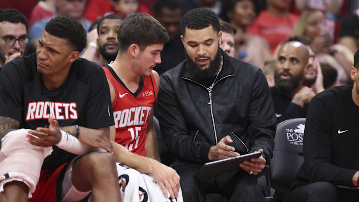 Nov 16, 2025; Houston, Texas, USA; Houston Rockets guard Reed Sheppard (15) talks with guard Fred VanVleet (right) on the bench during the game against the Orlando Magic at Toyota Center. Mandatory Credit: Troy Taormina-Imagn Images