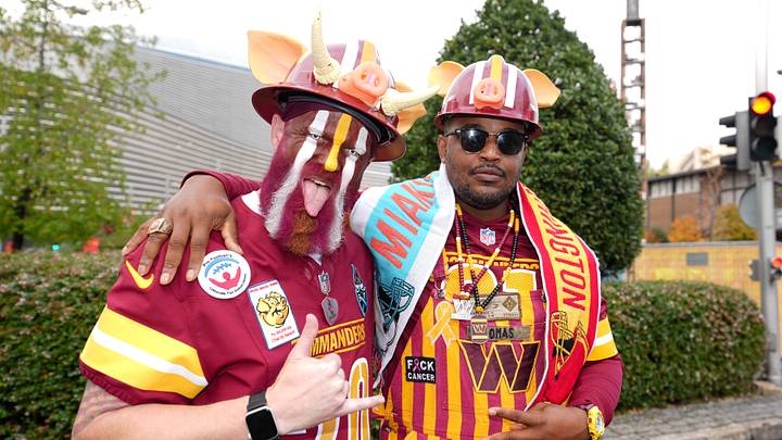 Nov 16, 2025; Madrid, Spain; Washington Commanders fans pose for a photo prior to the 2025 NFL Madrid Game between the Miami Dolphins and the Washington Commanders at Santiago Bernabeu Stadium. Mandatory Credit: Kirby Lee-Imagn Images