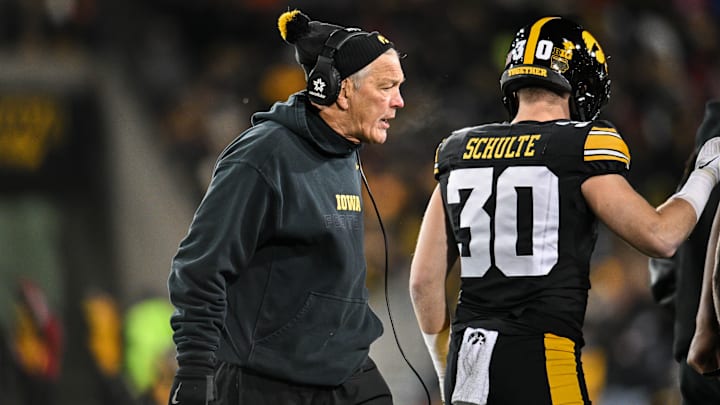 Nov 29, 2024; Iowa City, Iowa, USA; Iowa Hawkeyes head coach Kirk Ferentz reacts as defensive back Quinn Schulte (30) looks on during the first quarter against the Nebraska Cornhuskers at Kinnick Stadium. Mandatory Credit: Jeffrey Becker-Imagn Images