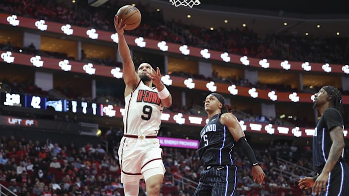Houston Rockets forward Dillon Brooks (9) shoots the ball as Orlando Magic forward Paolo Banchero (5) defends during the second quarter at Toyota Center.