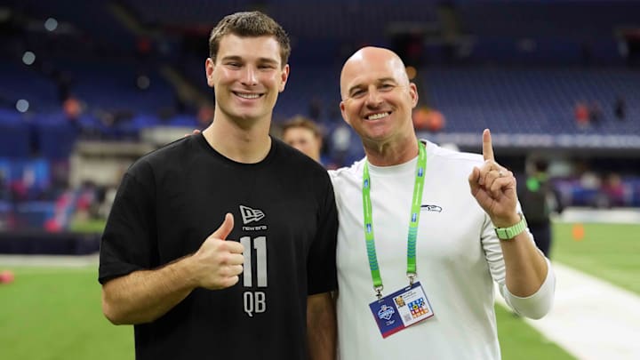 Feb 28, 2026; Indianapolis, IN, USA; Indiana quarterback Fernando Mendoza (QB11) poses with former Seattle Seahawks quarterback Matt Hasselbeck during the NFL Scouting Combine at Lucas Oil Stadium. Mandatory Credit: Kirby Lee-Imagn Images