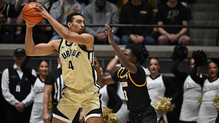 Purdue Boilermakers forward Trey Kaufman-Renn (4) looks to get the ball past Toledo Rockets guard Sonny Wilson (3) Purdue Boilermakers forward Trey Kaufman-Renn (4) looks to get the ball past Toledo Rockets guard Sonny Wilson (3)