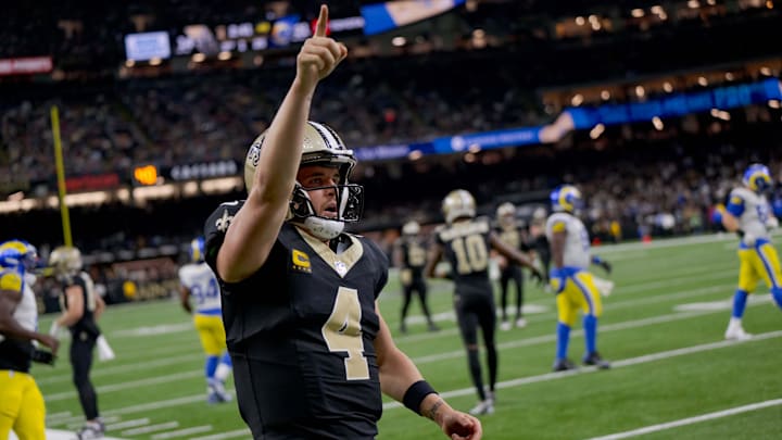Dec 1, 2024; New Orleans, Louisiana, USA; New Orleans Saints quarterback Derek Carr (4) reacts after rushing for a first down against the Los Angeles Rams during the fourth quarter at Caesars Superdome. Mandatory Credit: Matthew Hinton-Imagn Images