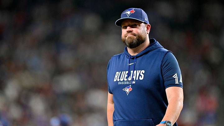 Sep 19, 2026; Arlington, Texas, USA; Toronto Blue Jays manager John Schneider walks back to the dugout during the sixth inning against the Texas Rangers at Globe Life Field. Mandatory Credit: Jerome Miron-Imagn Images Sep 19, 2026; Arlington, Texas, USA; Toronto Blue Jays manager John Schneider walks back to the dugout during the sixth inning against the Texas Rangers at Globe Life Field. Mandatory Credit: Jerome Miron-Imagn Images