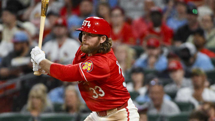 Apr 25, 2025; St. Louis, Missouri, USA;  St. Louis Cardinals second baseman Brendan Donovan (33) hits a one run single against the Milwaukee Brewers during the fifth inning at Busch Stadium. Mandatory Credit: Jeff Curry-Imagn Images