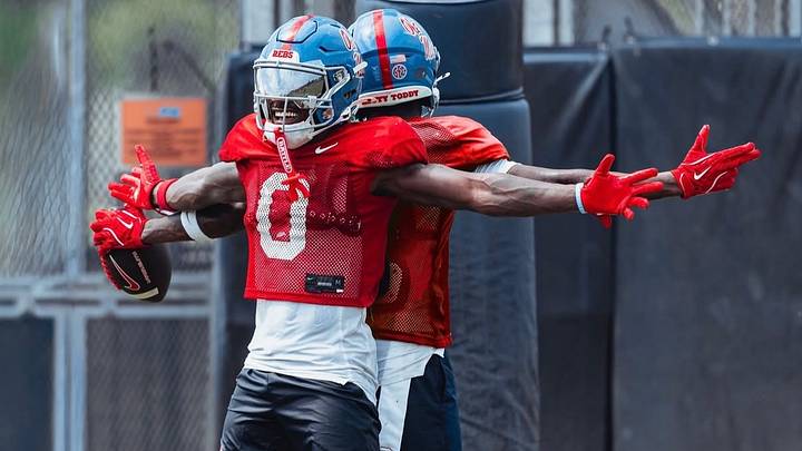 Ole Miss wide receivers Johntay Cook II and Deuce Alexander celebrate a touchdown during a fall camp practice (2026). Ole Miss wide receivers Johntay Cook II and Deuce Alexander celebrate a touchdown during a fall camp practice (2026).