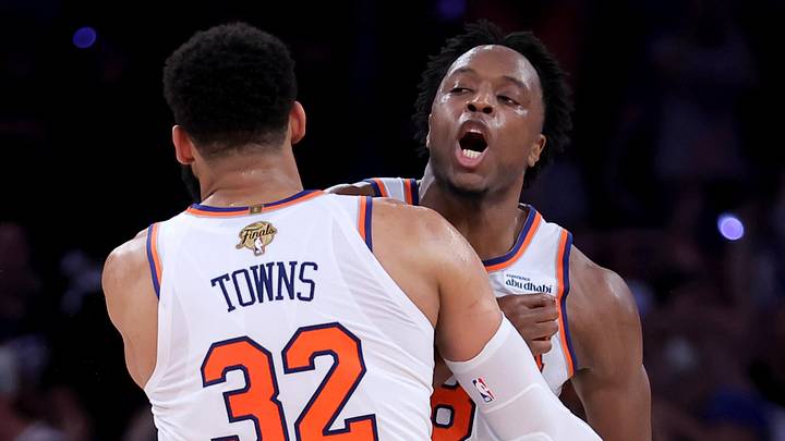 Jun 10, 2026; New York, New York, USA; New York Knicks center Karl-Anthony Towns (32) hugs forward OG Anunoby (8) after Anunoby's go ahead basket late during the fourth quarter of game four of the 2026 NBA Finals against the San Antonio Spurs at Madison Square Garden. Mandatory Credit: Brad Penner-Imagn Images
