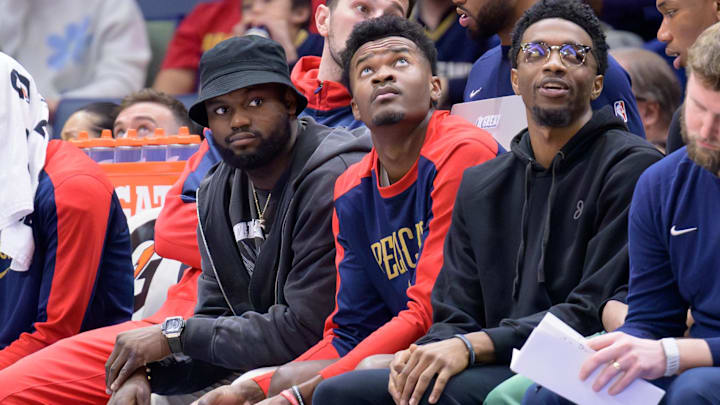 Jan 15, 2025; New Orleans, Louisiana, USA; New Orleans Pelicans forward Zion Williamson, left, center Yves Missi, and forward Herbert Jones (2) watch from the bench during the second half against the Dallas Mavericks at Smoothie King Center. Mandatory Credit: Matthew Hinton-Imagn Images Jan 15, 2025; New Orleans, Louisiana, USA; New Orleans Pelicans forward Zion Williamson, left, center Yves Missi, and forward Herbert Jones (2) watch from the bench during the second half against the Dallas Mavericks at Smoothie King Center. Mandatory Credit: Matthew Hinton-Imagn Images