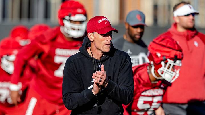 OU football coach Brent Venables works with his team during Thursday's practice in Norman.