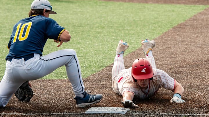 St. John’s base runner Jack Forgues dives back before the tag from Xaverian first baseman Nolan Rappoli in the fourth inning Tuesday. St. John’s base runner Jack Forgues dives back before the tag from Xaverian first baseman Nolan Rappoli in the fourth inning Tuesday.